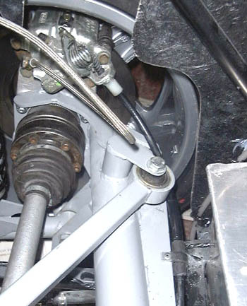 Handbrake cable p-clipped to back of de Dion tube